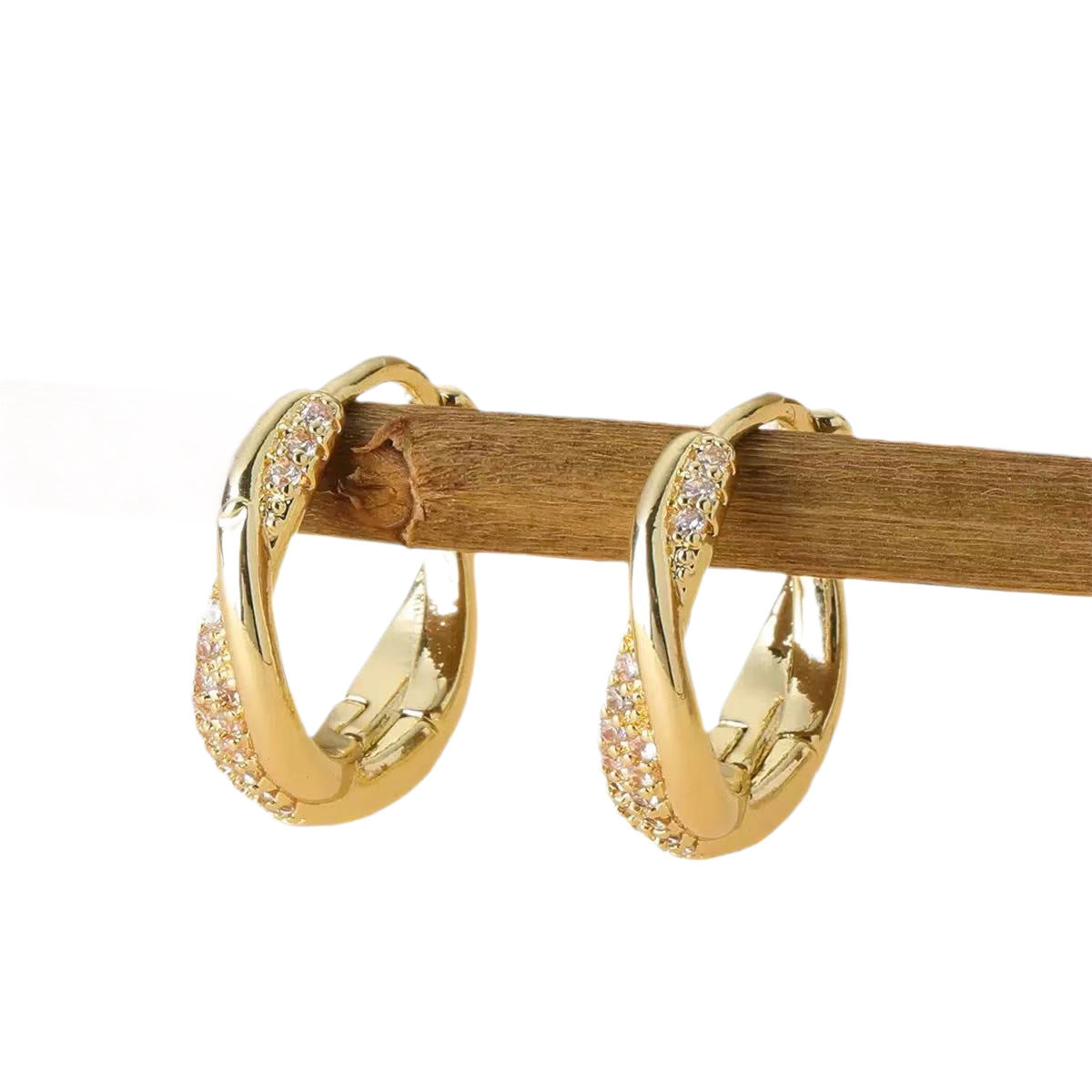 Boucles d'oreilles créoles torsadées en zircon